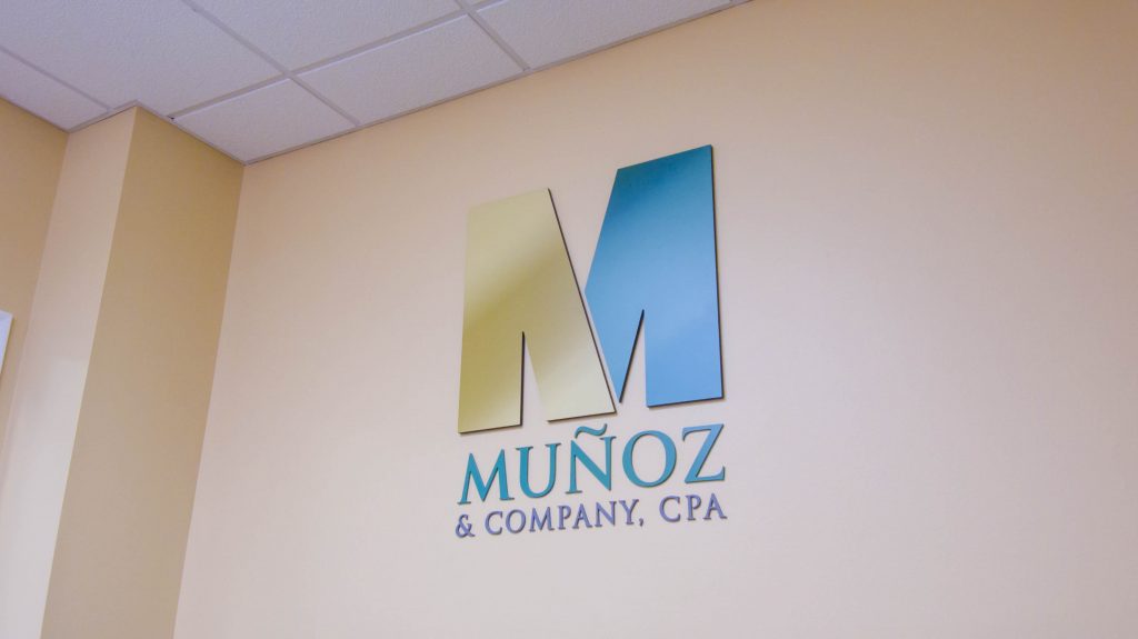 Beige wall with Munoz & Company, CPA logo